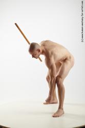 Nude Fighting with spear Man White Muscular Bald Realistic